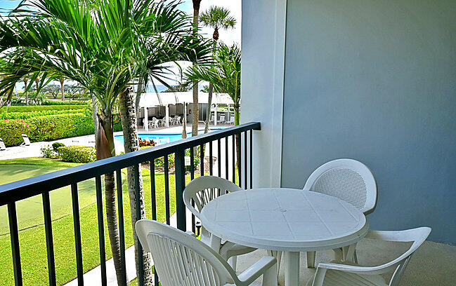 150 North Ocean Boulevard, Unit S26 Delray Beach, FL 33483 - Photo 8 of 8 a view of a chair and table in backyard