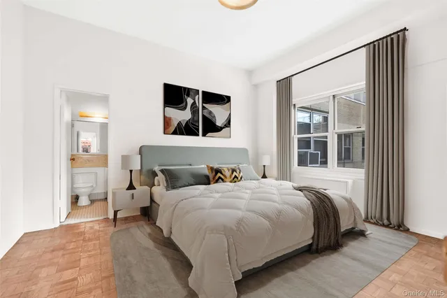 a bathroom with a granite countertop sink vanity mirror and bathtub