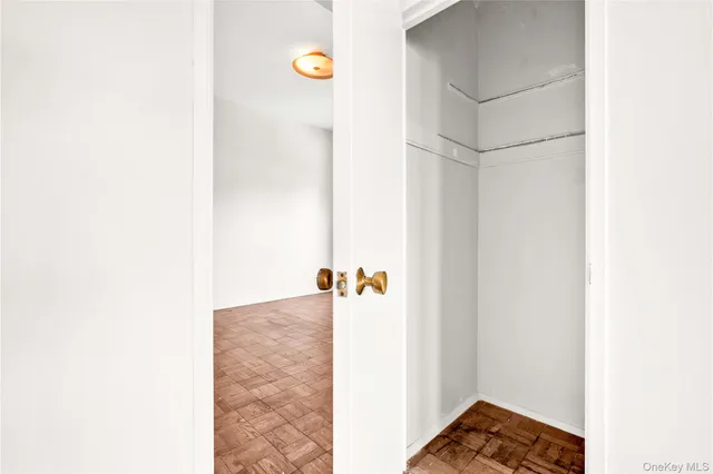 a bathroom with a toilet sink vanity and mirror