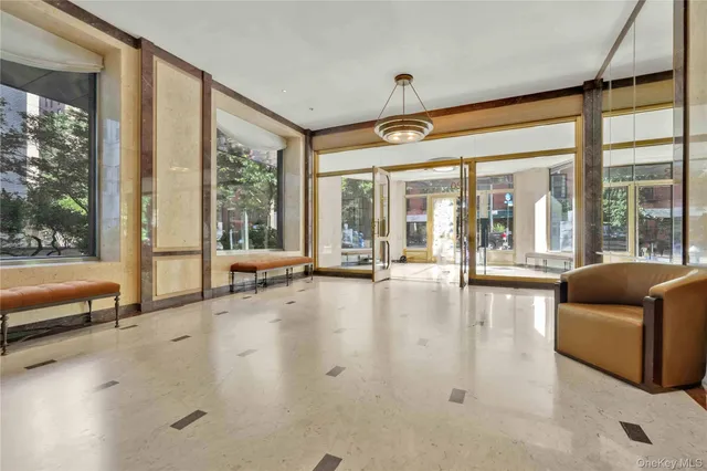 a view of a swimming pool with seating space