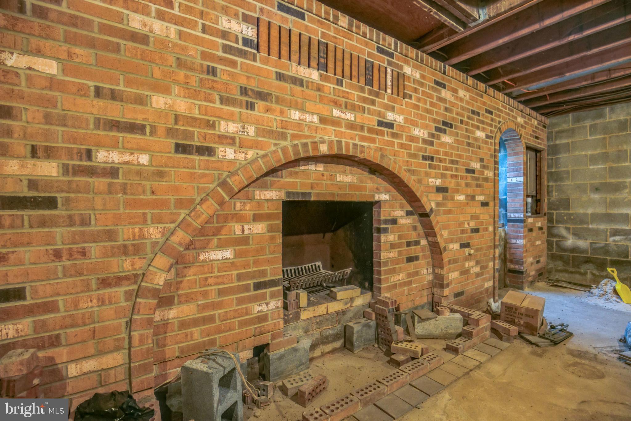 11606 Rivershore Drive Dunkirk, MD 20754 - Photo 30 of 33 Unfinished basement Fireplace