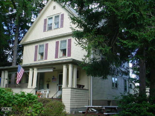 844 Daniels Farm Road Trumbull, CT 06611 - Photo 1 of 1 a view of a white house with large windows and a tree