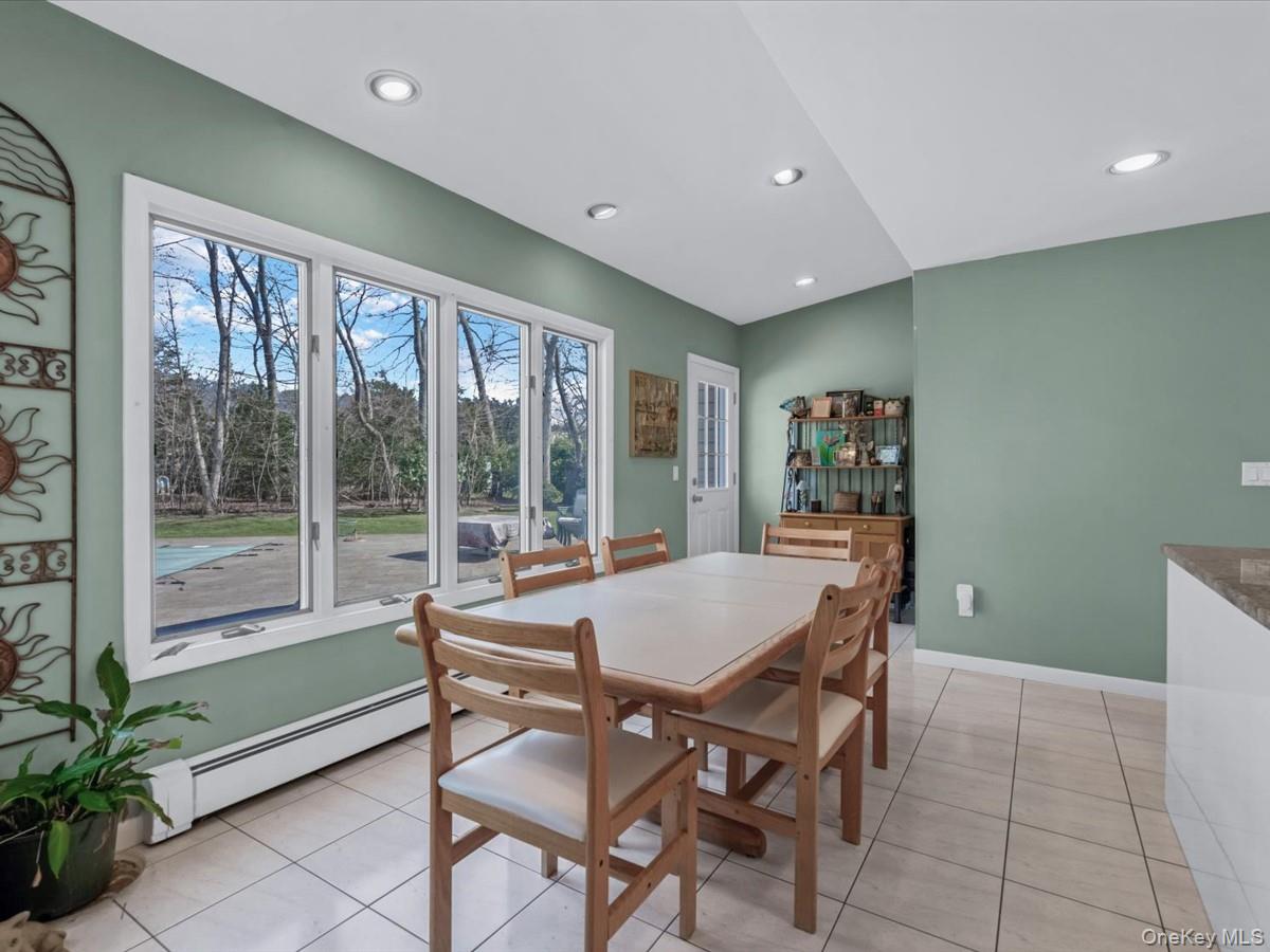 29 Sun Hill Road Nesconset, NY 11767 - Photo 12 of 32 a dining room with furniture and large windows