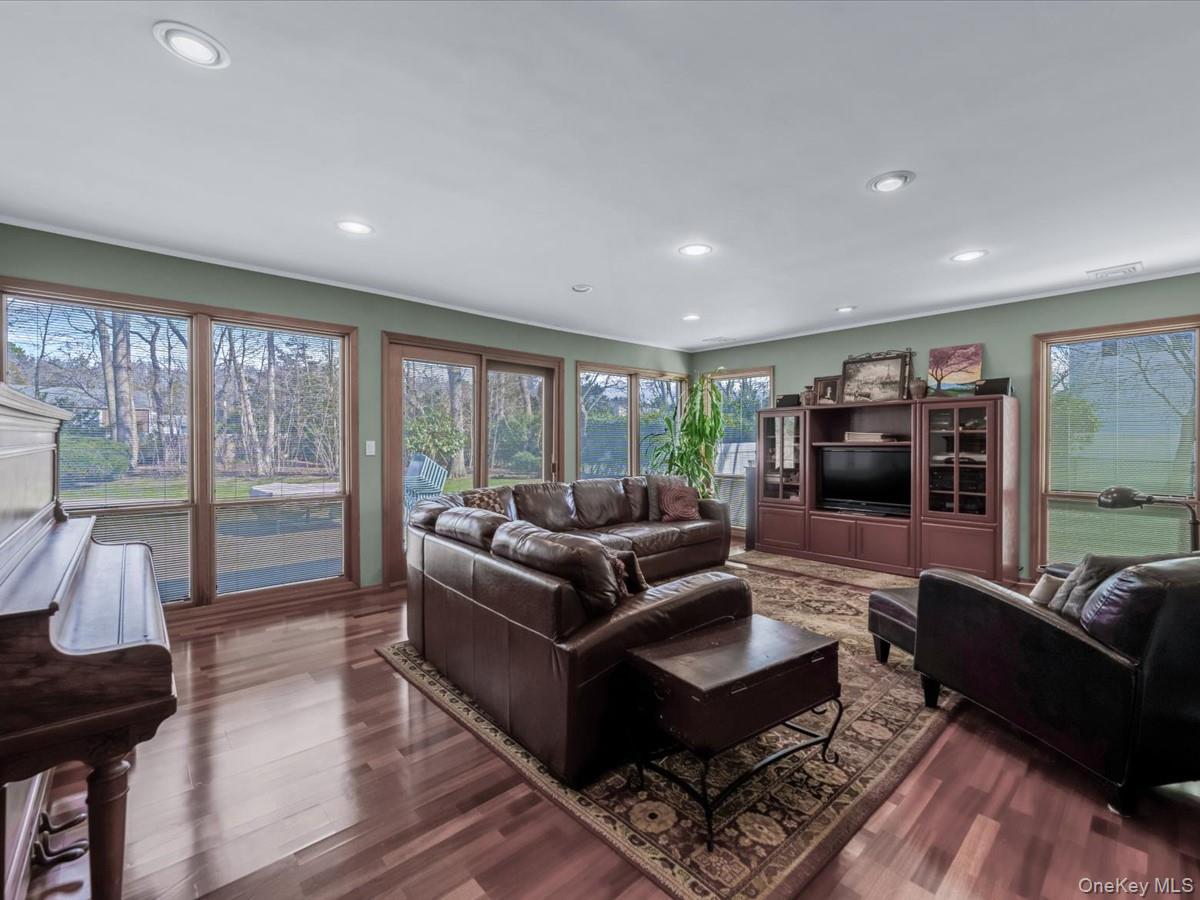 29 Sun Hill Road Nesconset, NY 11767 - Photo 15 of 32 a living room with furniture and a flat screen tv