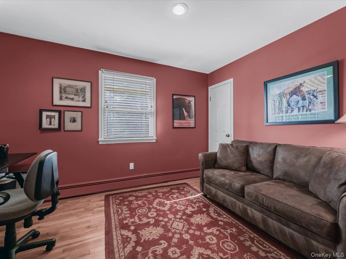 29 Sun Hill Road Nesconset, NY 11767 - Photo 20 of 32 a living room with furniture and a window