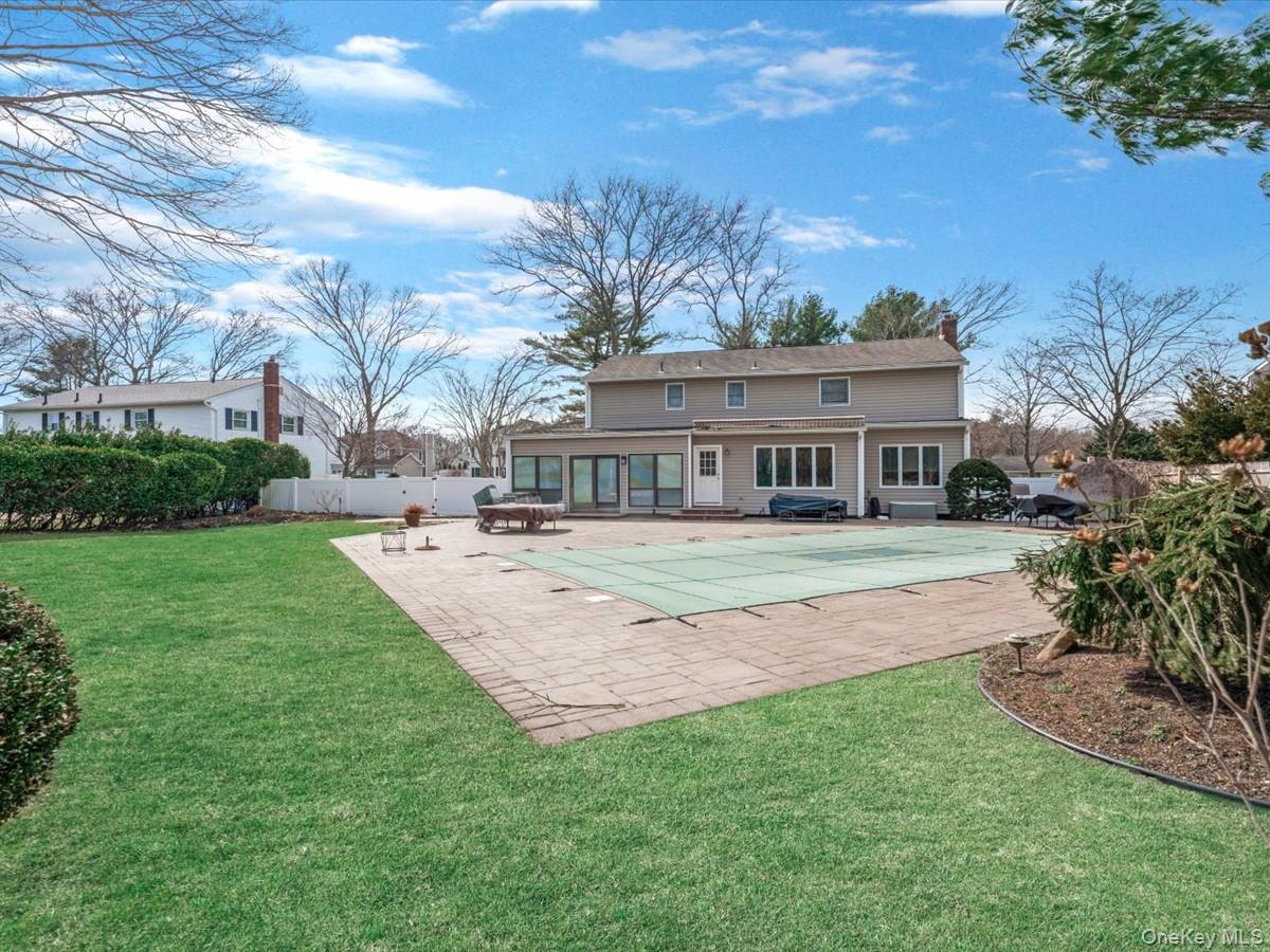 29 Sun Hill Road Nesconset, NY 11767 - Photo 27 of 32 a view of house with a garden
