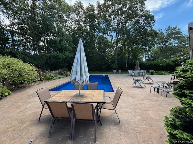 29 Sun Hill Road Nesconset, NY 11767 - Photo 29 of 32 a view of backyard with seating area and trees