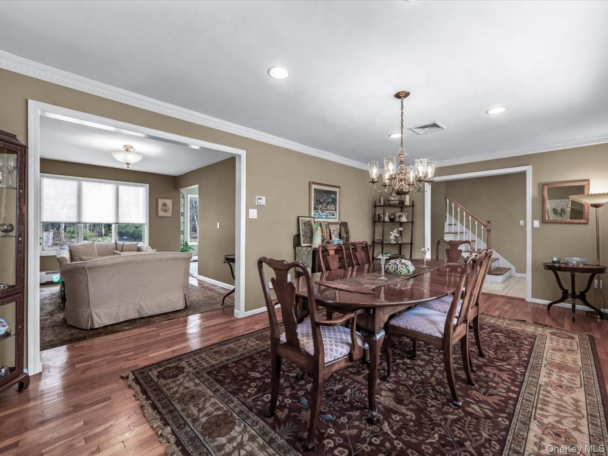 29 Sun Hill Road Nesconset, NY 11767 - Photo 8 of 32 a view of a dining room with furniture window and wooden floor