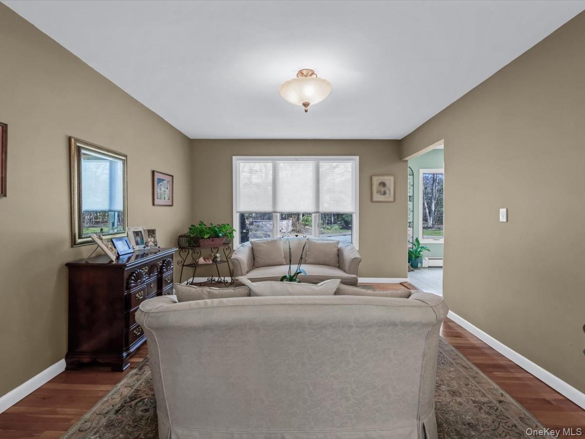 29 Sun Hill Road Nesconset, NY 11767 - Photo 10 of 32 a living room with furniture and a large window