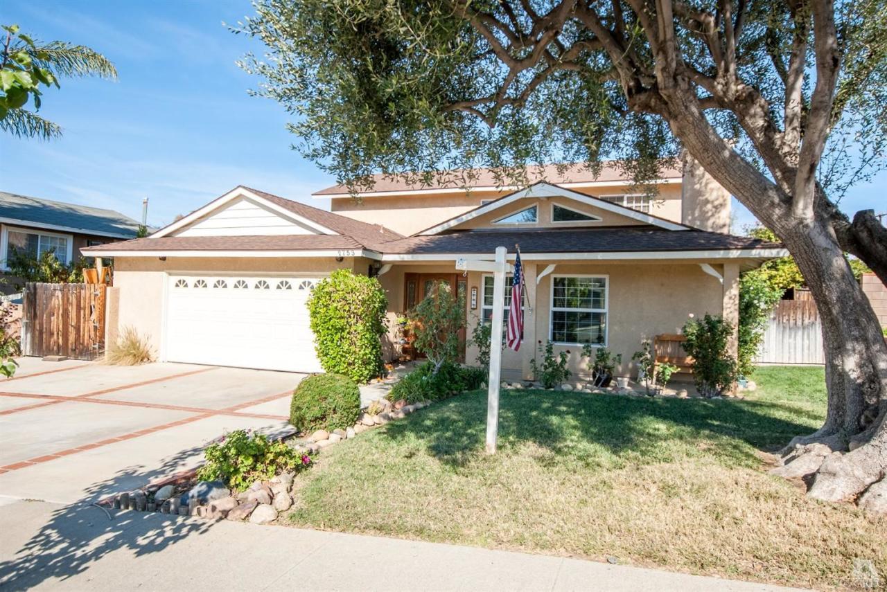 2753 Fitzgerald Road Simi Valley, CA 93065 - Photo 1 of 12 a front view of a house with garden