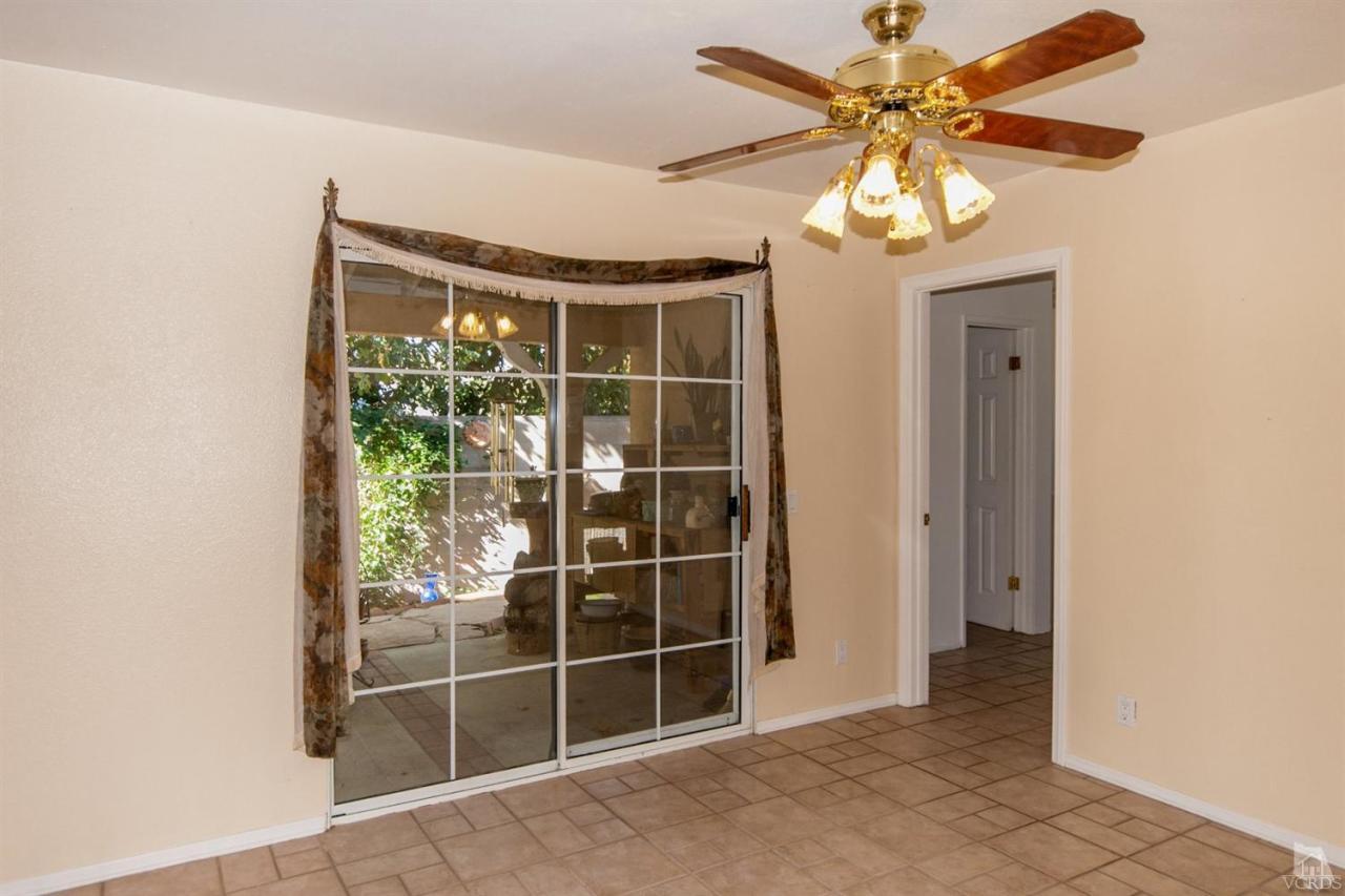 2753 Fitzgerald Road Simi Valley, CA 93065 - Photo 7 of 12 a view of a livingroom with a ceiling fan and a large window