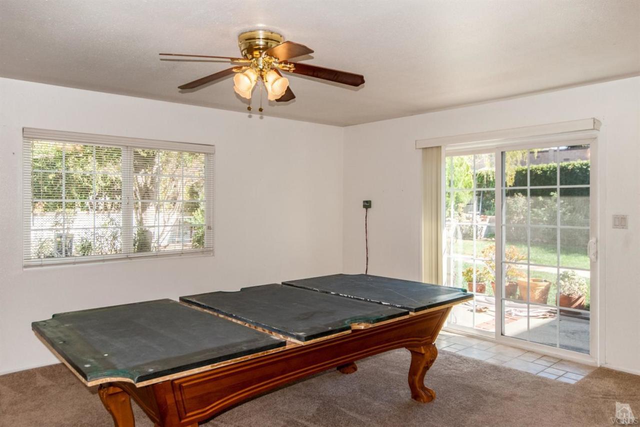 2753 Fitzgerald Road Simi Valley, CA 93065 - Photo 8 of 12 a bed sitting in a room next to a window