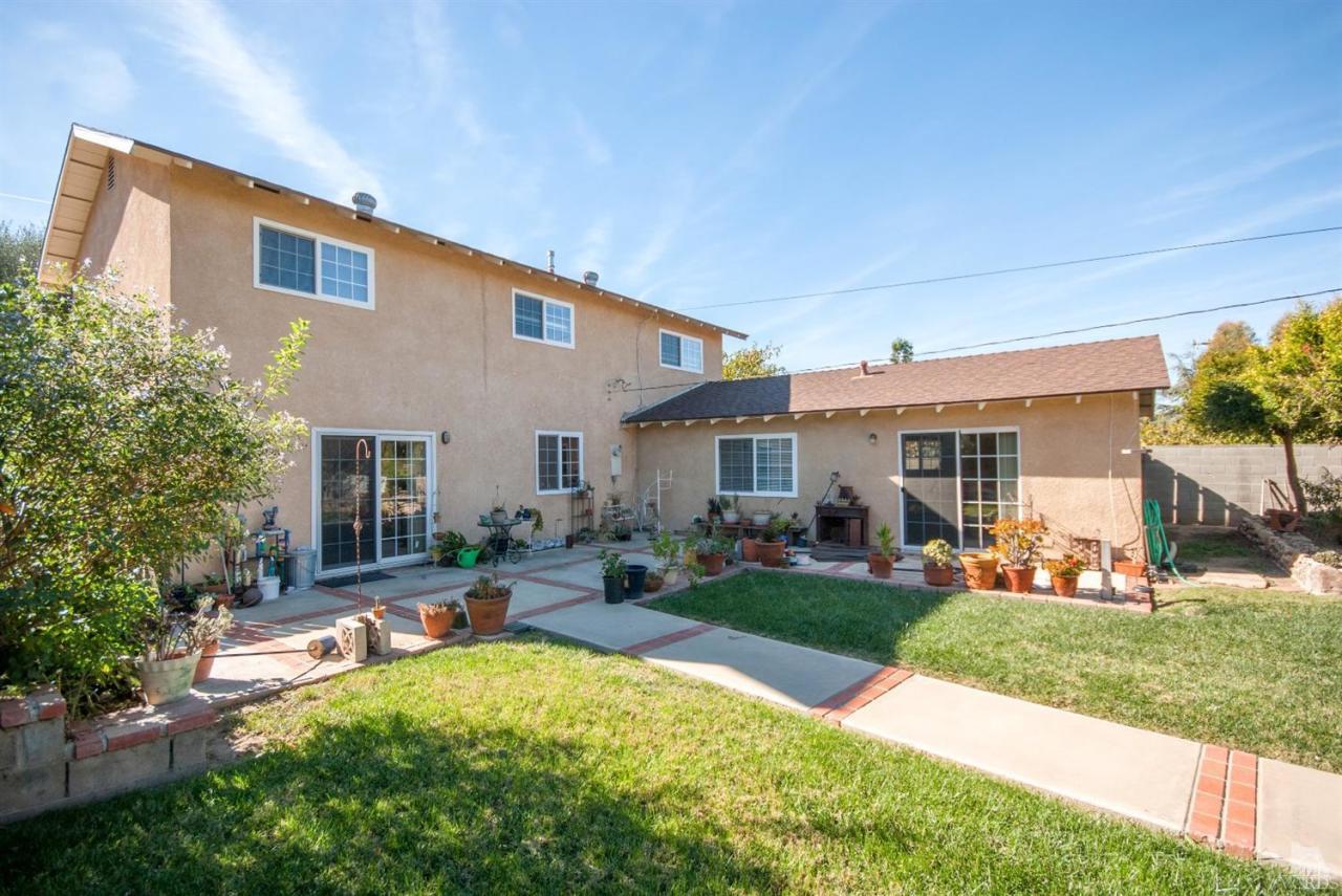 2753 Fitzgerald Road Simi Valley, CA 93065 - Photo 10 of 12 a front view of house with yard and outdoor seating
