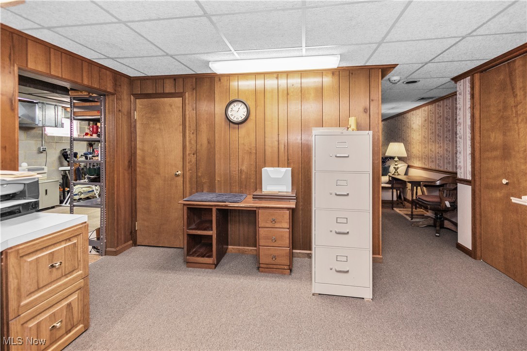 3158 Narrows Road Perry, OH 44081 - Photo 41 of 43 Home office featuring wooden walls, light colored carpet, and a paneled ceiling