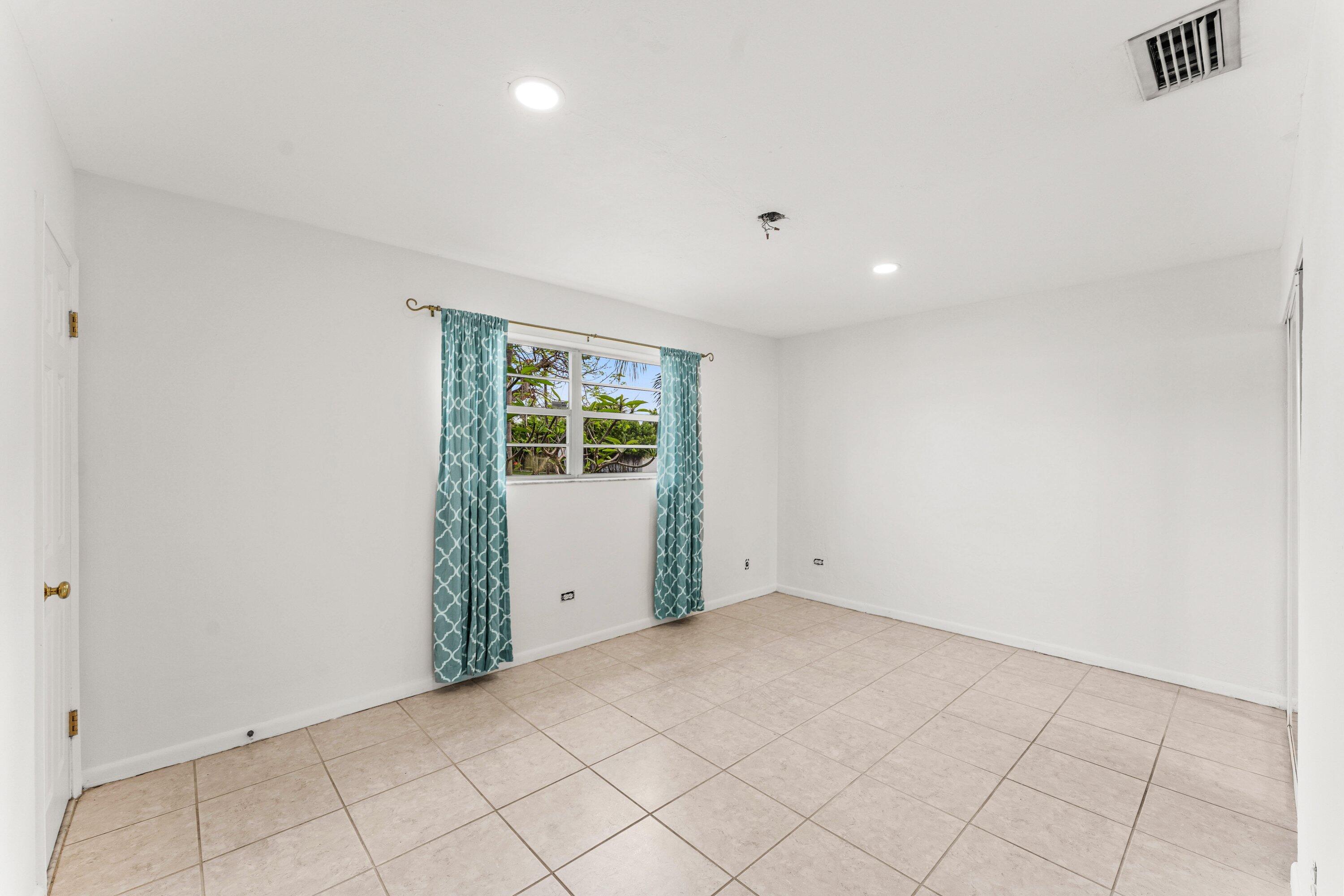 360 Northeast 23rd Way Boca Raton, FL 33431 - Photo 18 of 30 Primary Bedroom