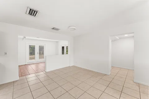 a view of an empty room and window