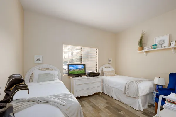 a bedroom with a bed and a couch