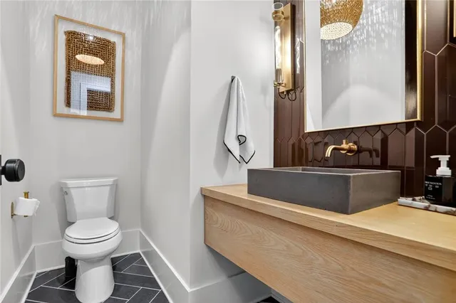 a vase of flowers sitting on a table with front door