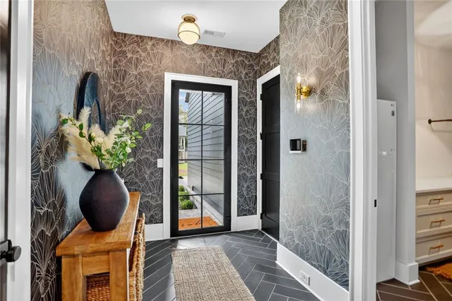 a view of a livingroom with hardwood floor and a large window