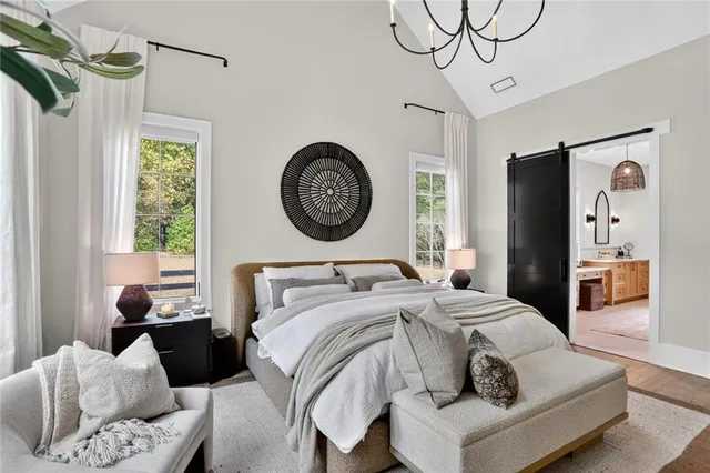 a bathroom with a tub sink shower and mirror
