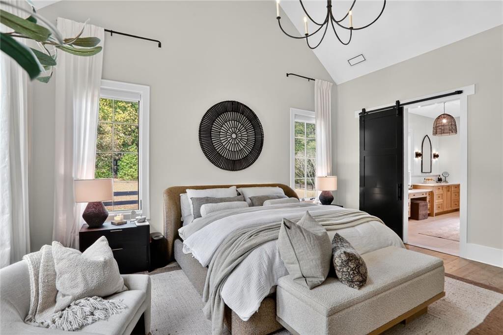 1510 Batesville Road Canton, GA 30115 - Photo 21 of 68 a bedroom with a bed a mirror and a window