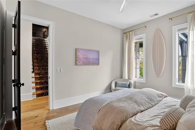 a bedroom with bed and a window