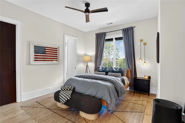 a view of a livingroom with furniture and a hardwood floor