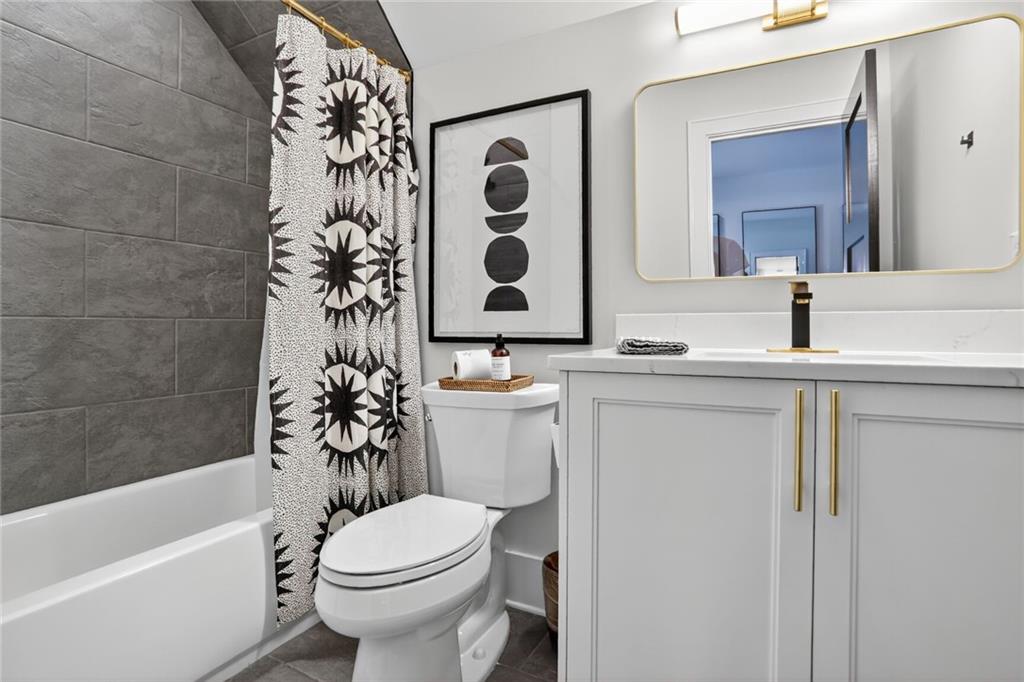 1510 Batesville Road Canton, GA 30115 - Photo 36 of 68 a bathroom with a sink a toilet and shower