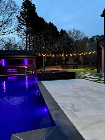 a front view of a building and trees