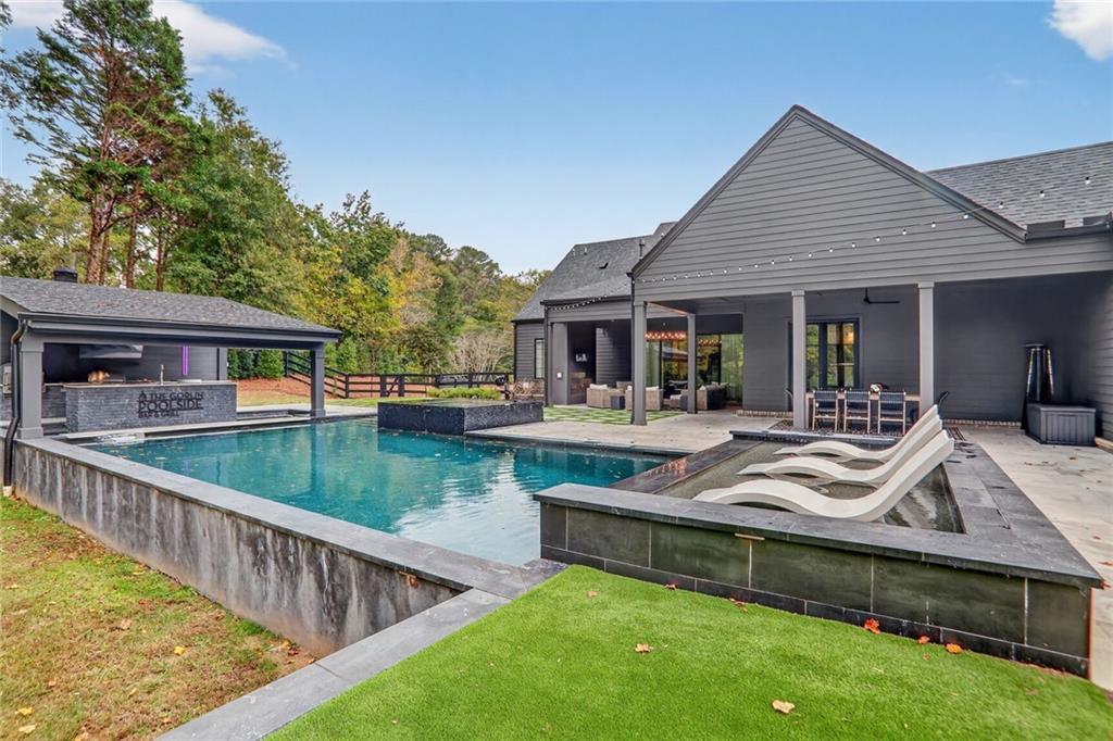 1510 Batesville Road Canton, GA 30115 - Photo 52 of 68 a view of house with swimming pool and outdoor seating