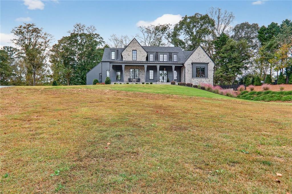 1510 Batesville Road Canton, GA 30115 - Photo 56 of 68 a front view of a house with yard and green space