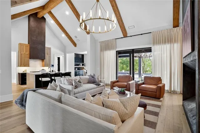 a living room with furniture and a large mirror