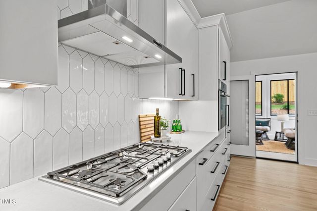a view of a patio with a dining table and chairs