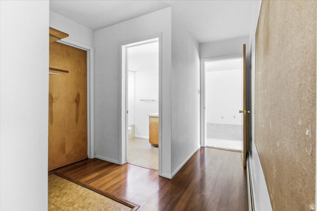 217 East 400 South Spring City, UT 84662 - Photo 25 of 71 Corridor featuring wood finished floors and a baseboard radiator
