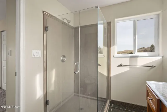 a bathroom with a shower and a sink