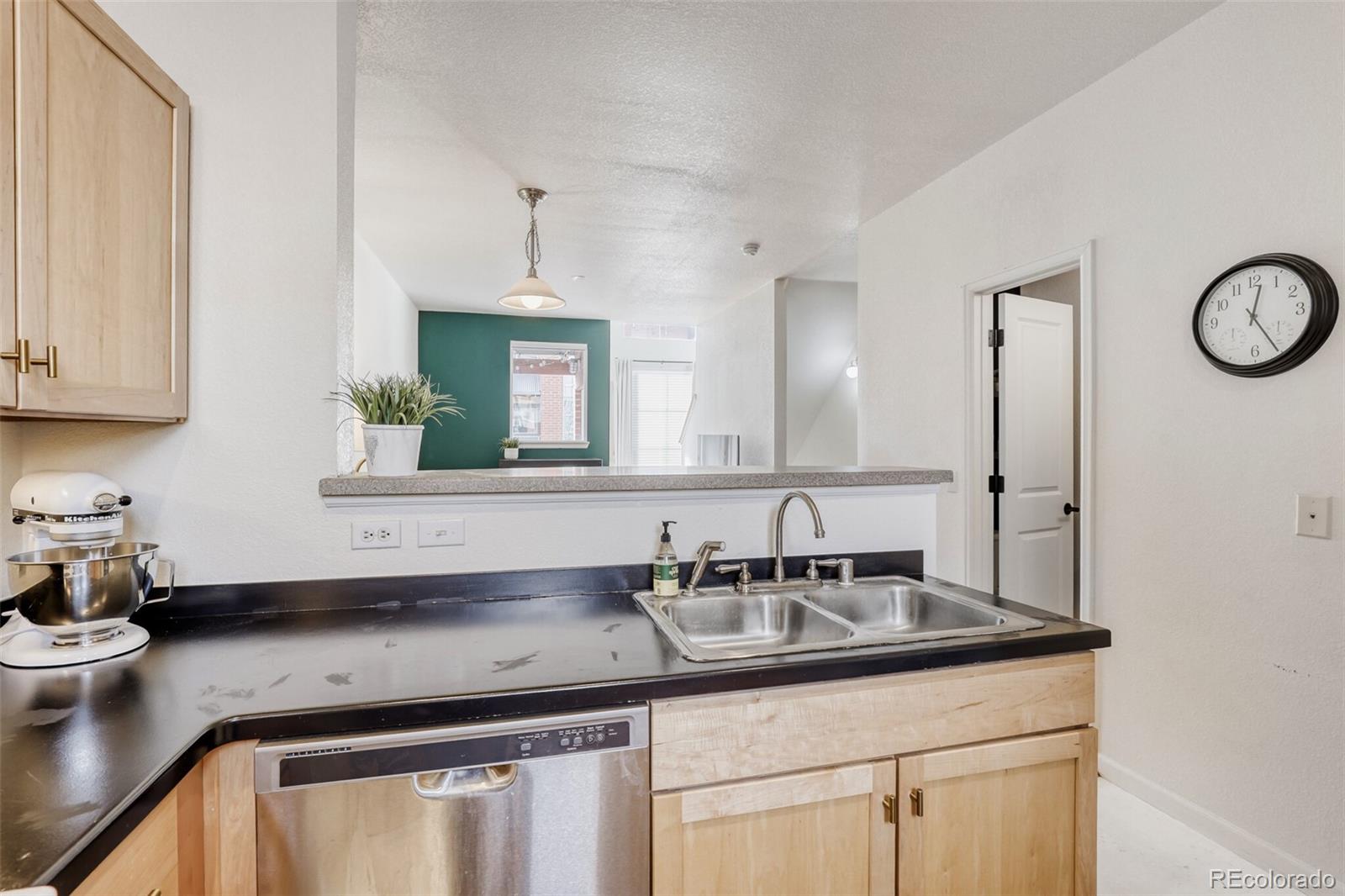 85 Uinta Way, Unit 702 Denver, CO 80230 - Photo 13 of 28 a bathroom with a sink and a mirror