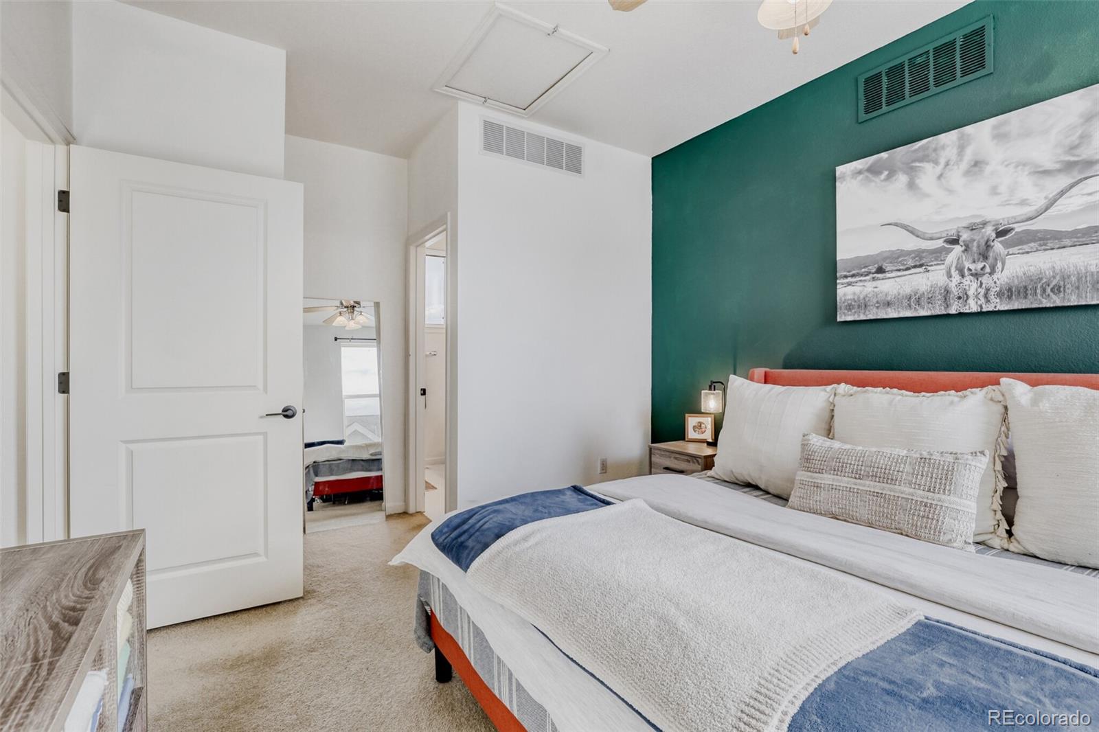 85 Uinta Way, Unit 702 Denver, CO 80230 - Photo 16 of 28 a bedroom with a bed and a couch
