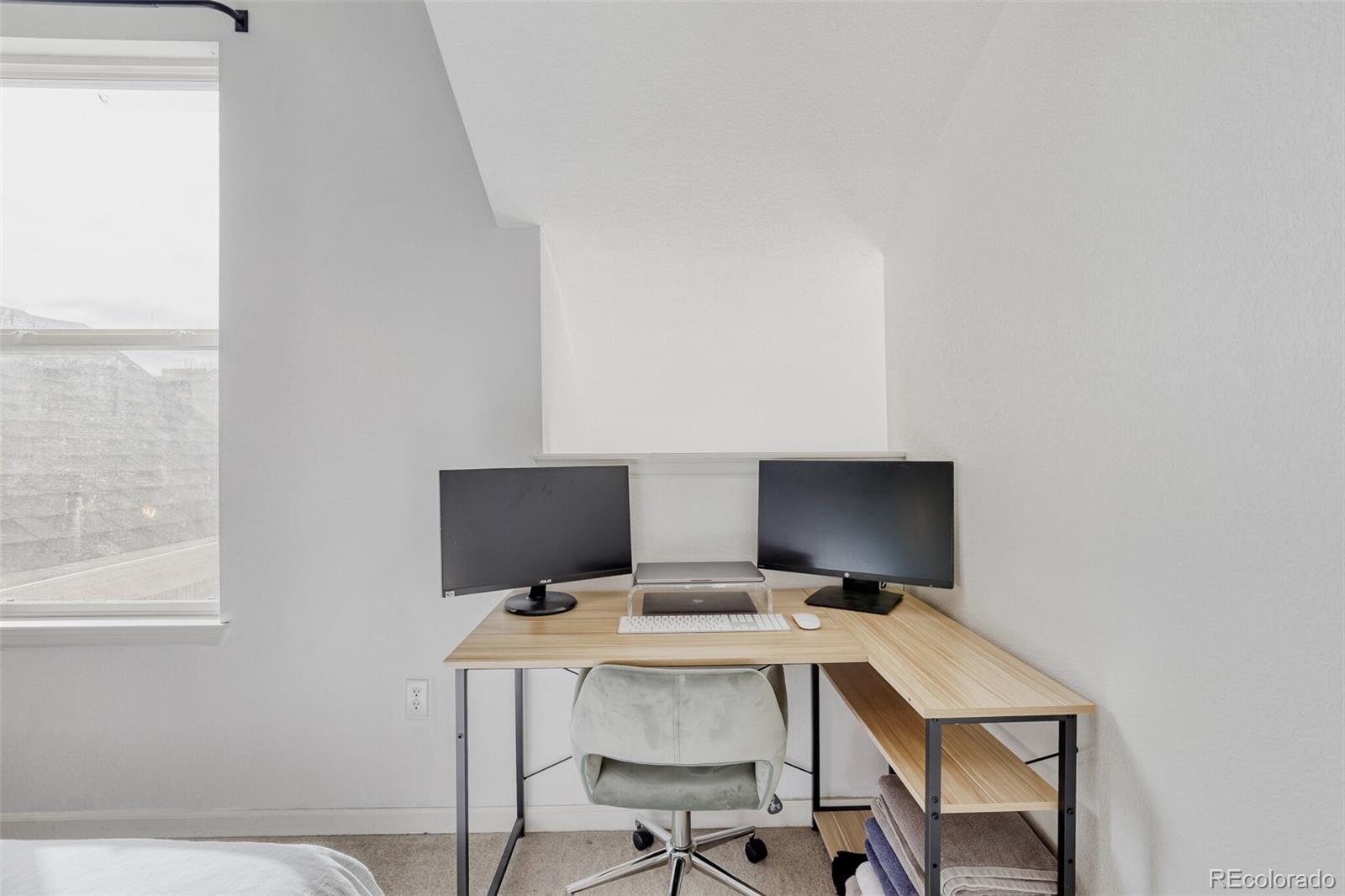 85 Uinta Way, Unit 702 Denver, CO 80230 - Photo 18 of 28 a view of a workspace with furniture
