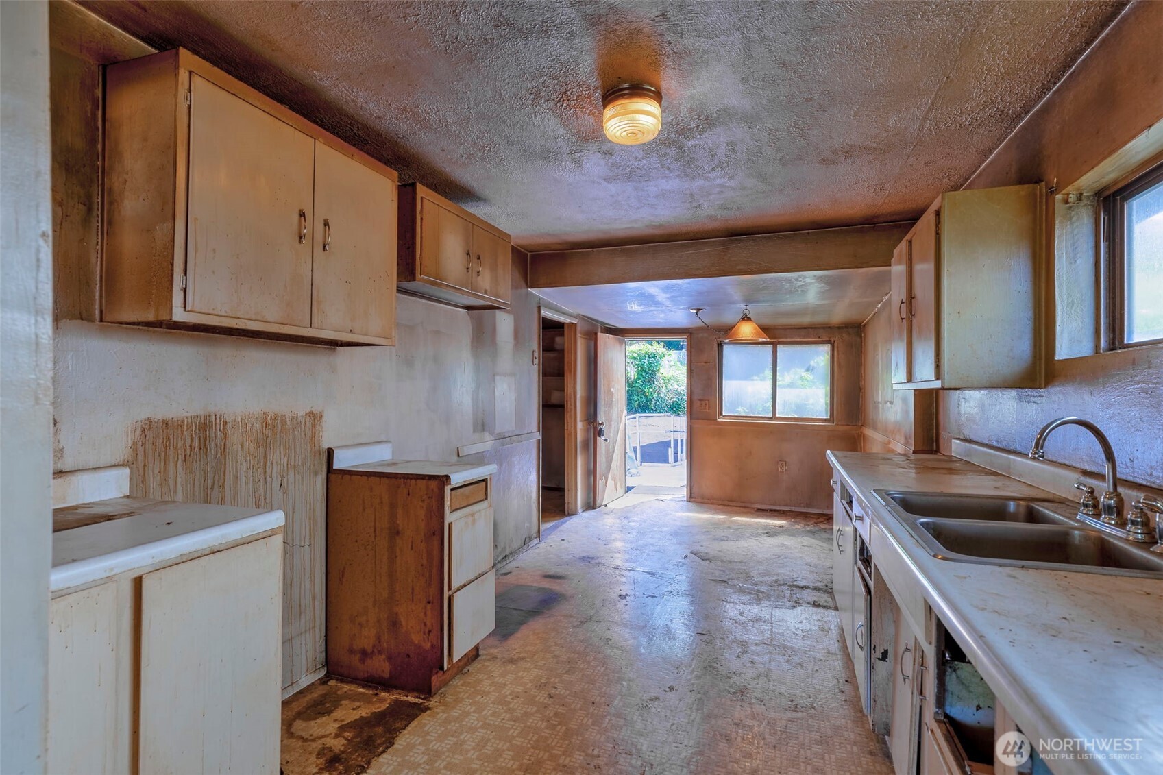 1112 Perry Avenue Bremerton, WA 98310 - Photo 11 of 21 a kitchen with stainless steel appliances granite countertop a sink a stove and a refrigerator