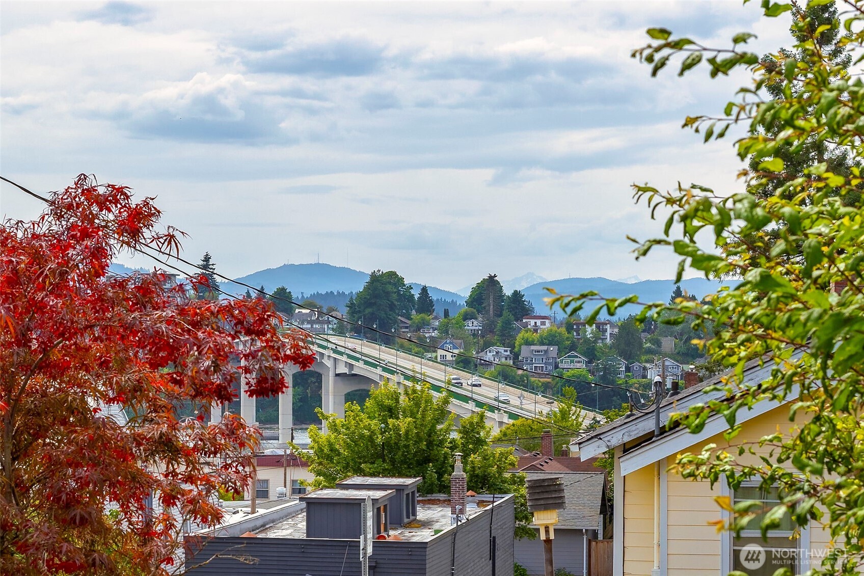 1112 Perry Avenue Bremerton, WA 98310 - Photo 2 of 21 a backyard of a house with lots of green space