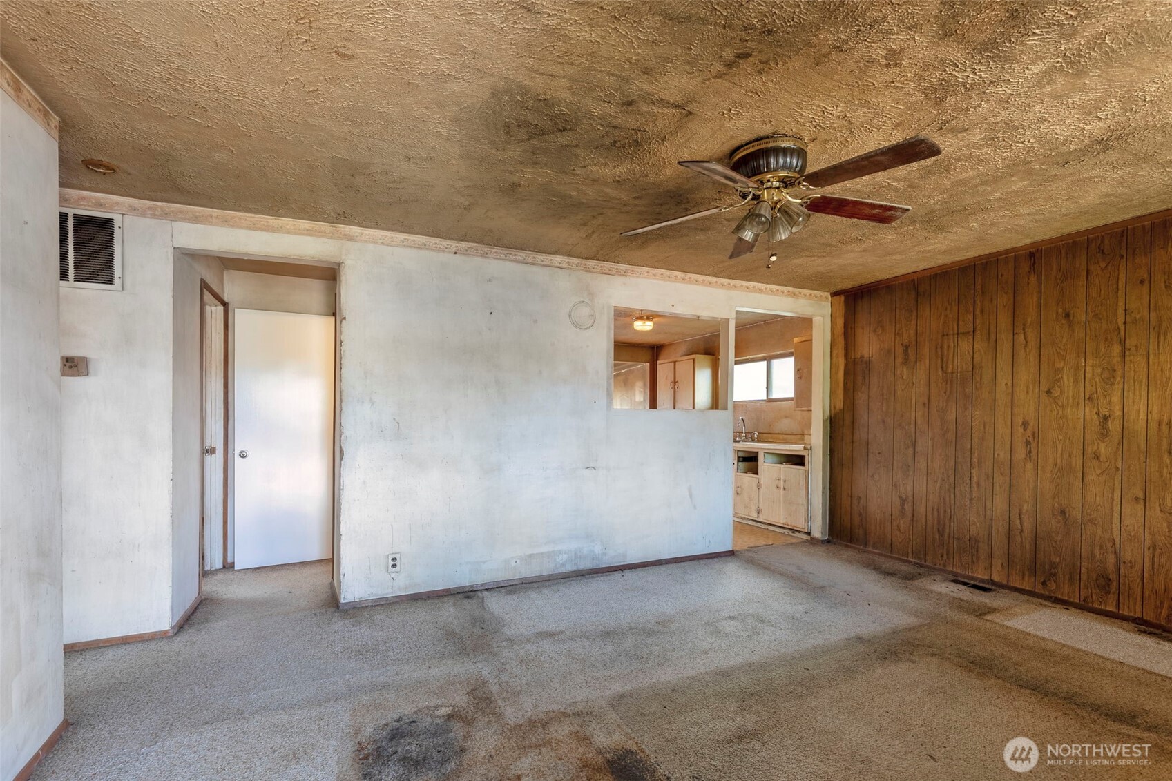 1112 Perry Avenue Bremerton, WA 98310 - Photo 8 of 21 a view of a livingroom with a ceiling fan and a window