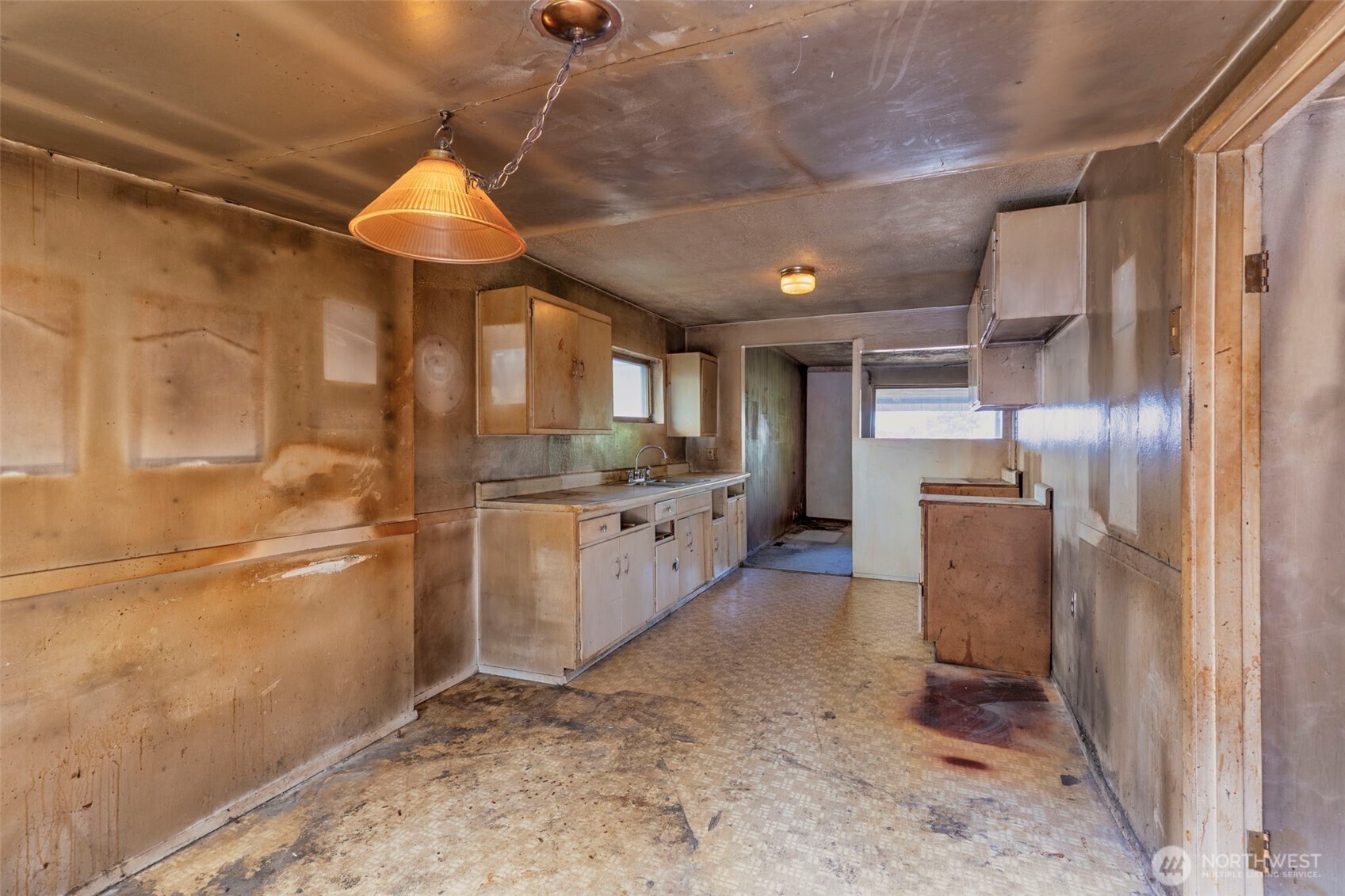1112 Perry Avenue Bremerton, WA 98310 - Photo 9 of 21 a kitchen with stainless steel appliances a refrigerator and a sink