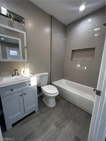 a bathroom with a toilet a sink and a bathtub