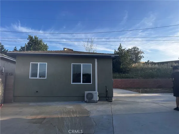 a roof deck with table and chairs