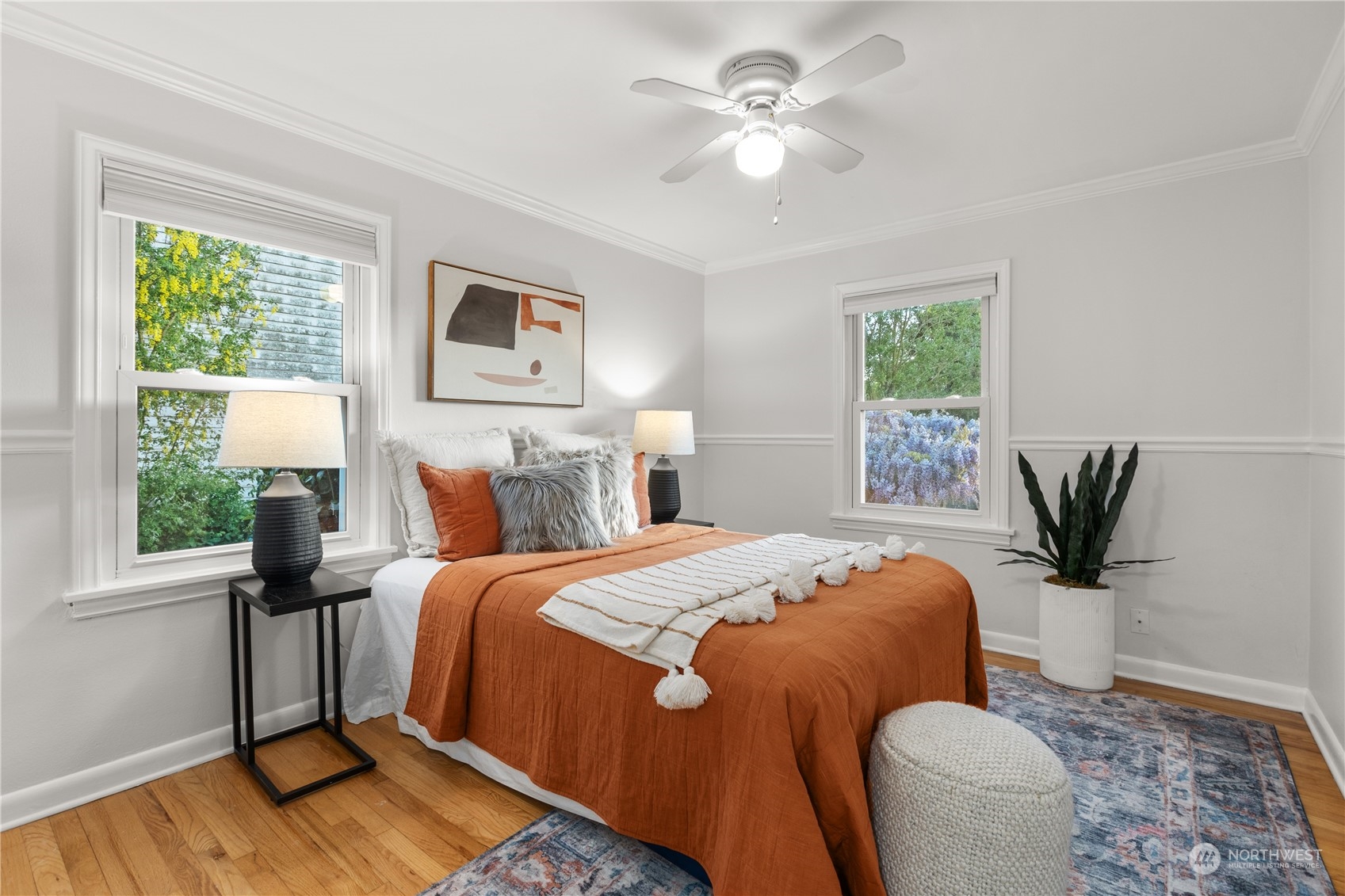 14357 36th Avenue Northeast Seattle, WA 98125 - Photo 11 of 23 a bedroom with a bed and a chandelier