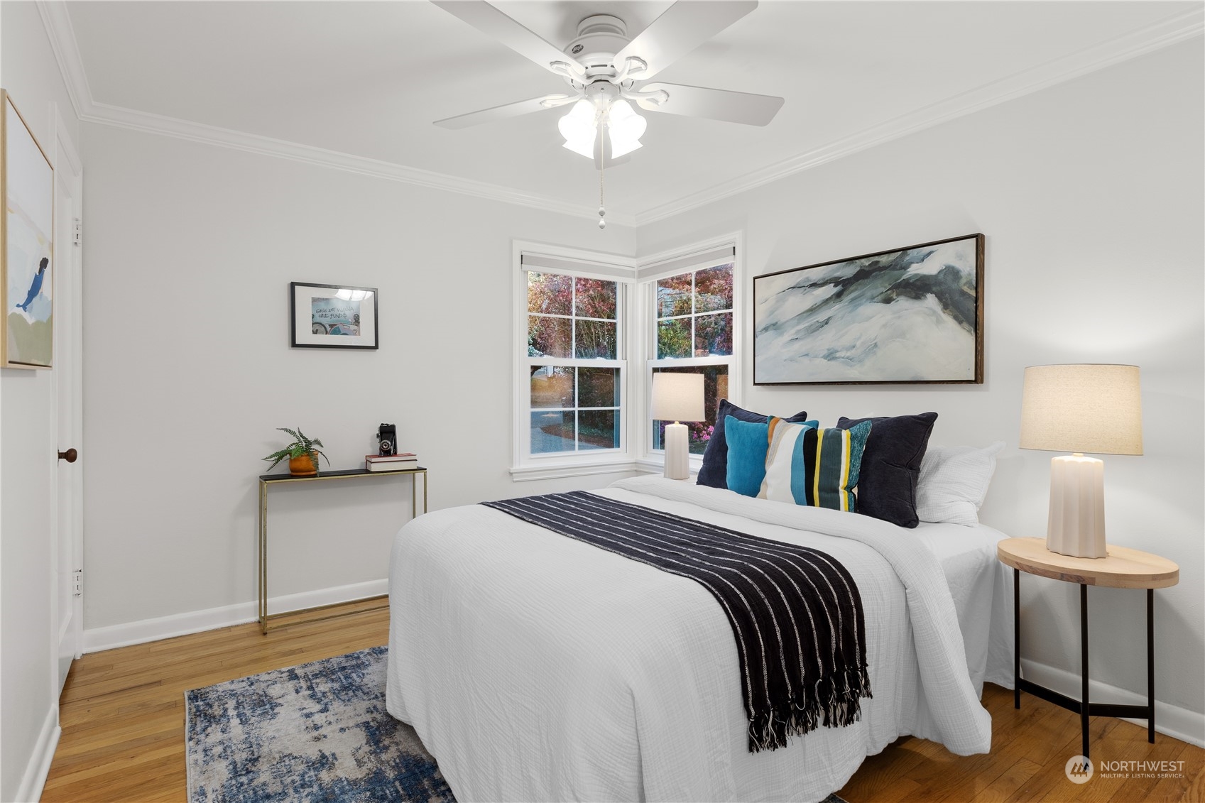 14357 36th Avenue Northeast Seattle, WA 98125 - Photo 12 of 23 a bedroom with a bed and a chandelier