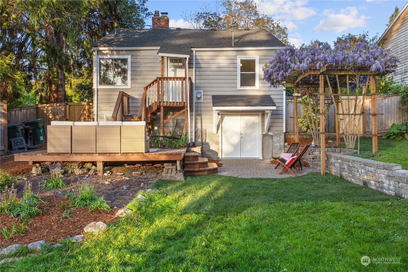 14357 36th Avenue Northeast Seattle, WA 98125 - Photo 18 of 23 a view of a house with a yard and sitting area