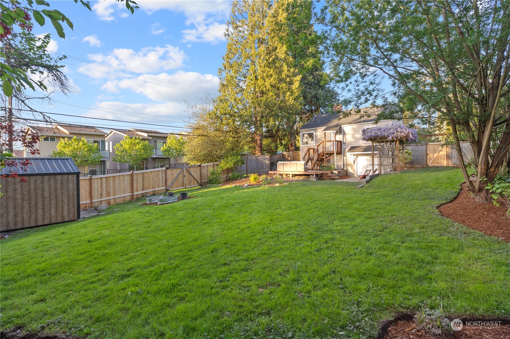 14357 36th Avenue Northeast Seattle, WA 98125 - Photo 22 of 23 a view of a yard with large trees