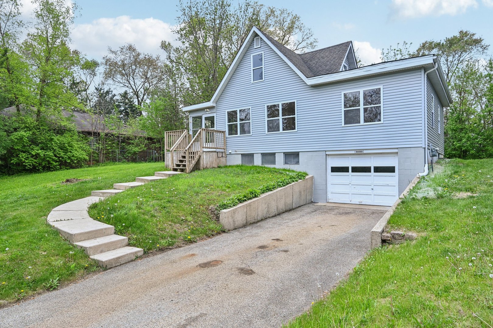 28549 West High Road Ingleside, IL 60041 - Photo 48 of 52 a front view of a house with a yard and garage
