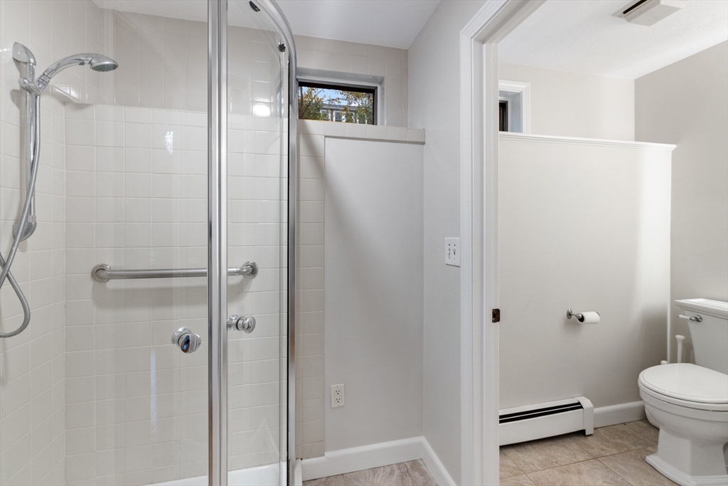 25 Curtis Street Marblehead, MA 01945 - Photo 14 of 28 a bathroom with a toilet and a shower